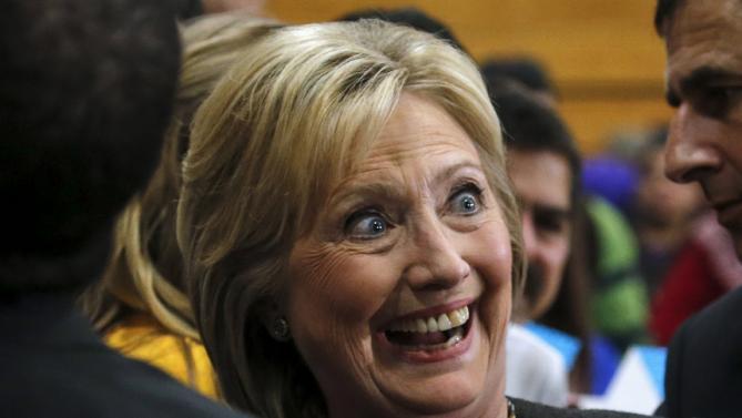 U.S. Democratic presidential candidate Hillary Clinton poses for a photo with supporters following a campaign rally in Manchester, New Hampshire